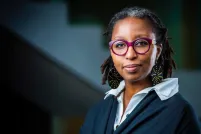 Portrait of a woman looking into the camera.