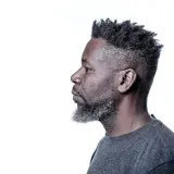  Head shot of a bearded man in profile.