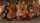 Plusieurs violons restaurés sont présentés appuyés les uns sur les autres dans une pile. Chacun des violons porte au moins une étoile de David.